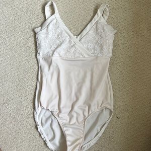White v neck leotard with lace.